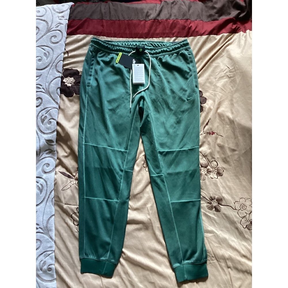 Nike sportwear jersey‎ pants wash revival size: large color: galactic jade